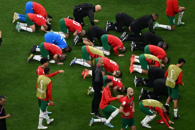 Players of Morocco perform Sujud as a gesture of thanks to Allah after the FIFA World Cup 2022 semi final between France and Morocco