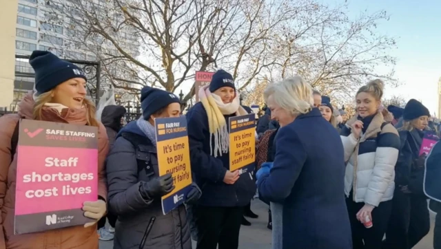 Dame Ruth May joins nurses outside St Thomas' Hospital in London