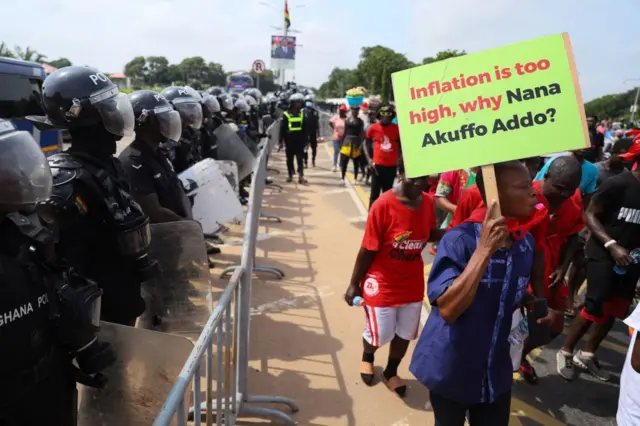 Protesters march towards the Presidential Palace on the second day of a demonstration over soaring living costs in Accra, Ghana, on June 29, 2022