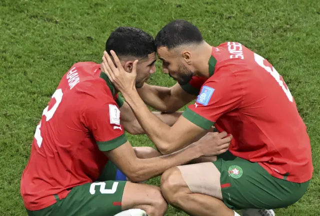 Players of Morocco console each other