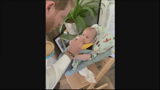 Harry feeding Archie