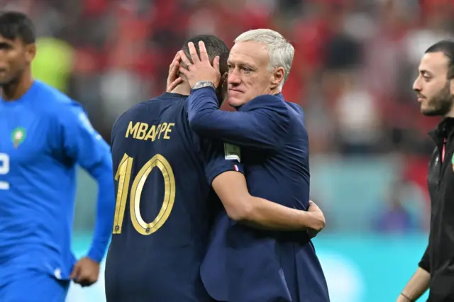 Kylian Mbappe (10) of France celebrates with head coach Didier Deschamps