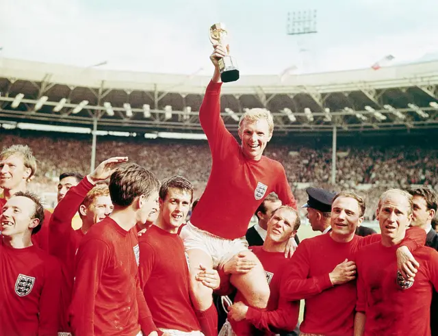 Bobby Moore holds the World Cup trophy aloft