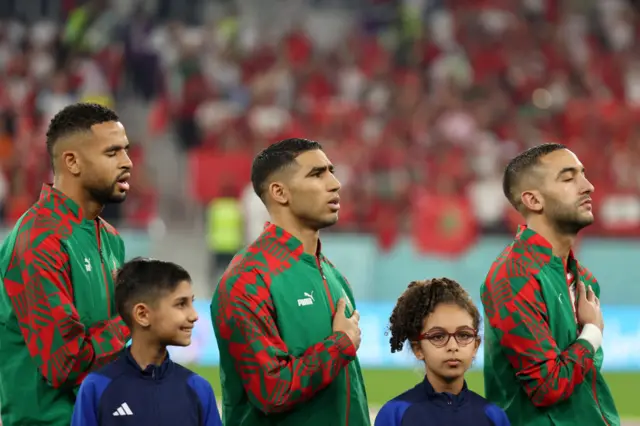 Morocco's players sing the national anthem