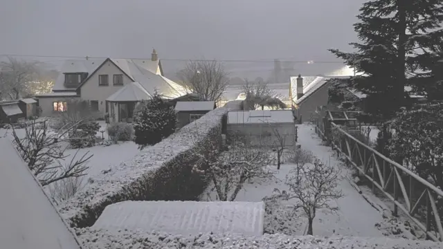 Snowy rooftops in Woodside