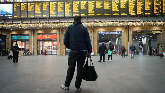 Passengers at Kings Cross Station in London during strike action by members of the Rail, Maritime and Transport union (RMT) in a long-running dispute over jobs and pensions