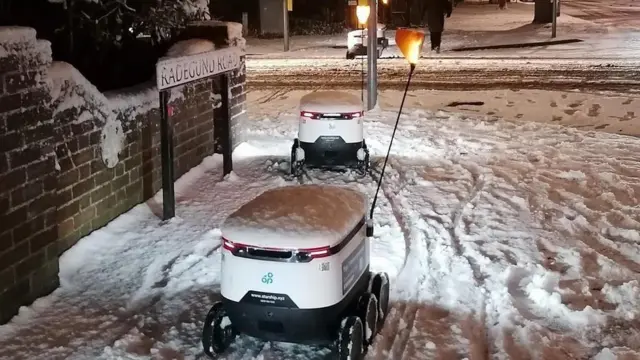 Delivery robots out in the snow in Cambridge