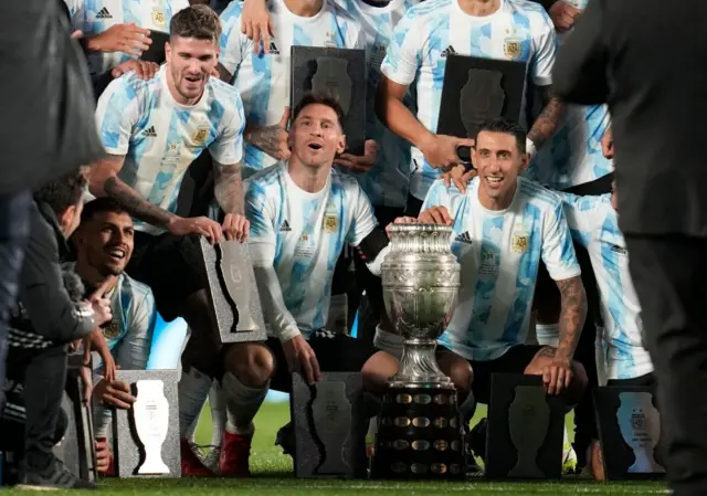 Lionel Messi (centre) with the Copa America title