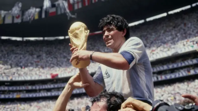 Diego Maradona with the World Cup trophy in 1986