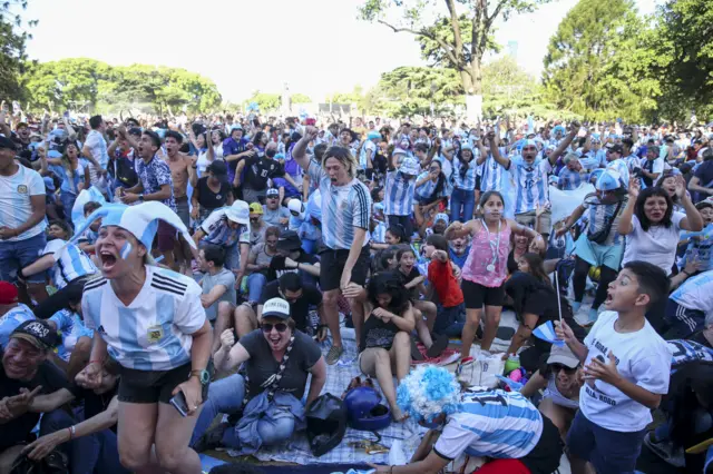 Argentina fans celebrate a goal for their team in Buenos Airies