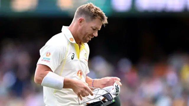 David Warner walks off the pitch after being dismissed