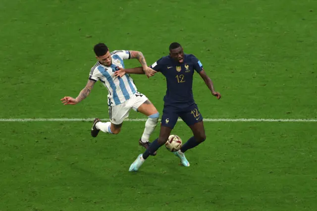 Nicolas Otamendi of Argentina fouls Randal Kolo Muani of France which leads to a penalty for France during the FIFA World Cup Qatar 2022 Final match between Argentina and France at Lusail Stadium