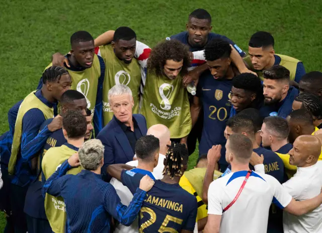 Didier Deschamps speaks to his players at full-time