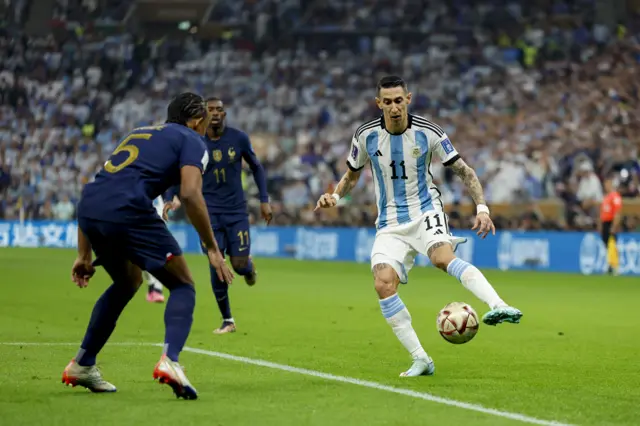 Angel di Maria runs at Jules Kounde