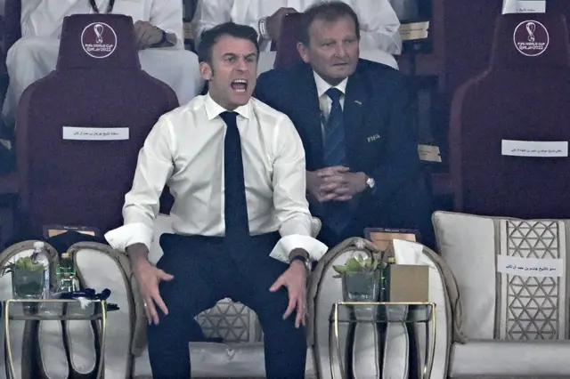 French President Emmanuel Macron reacts during the Qatar 2022 World Cup final football match between Argentina and France at Lusail Stadium in Lusail, north of Doha