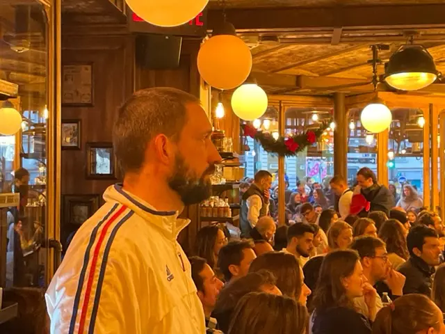 Fans in a Paris bar watching the 2022 World Cup final