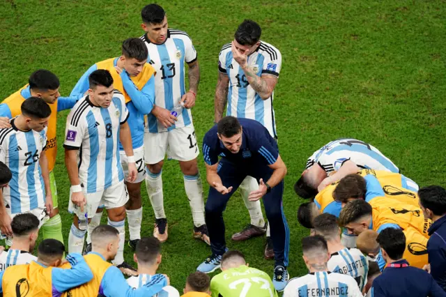 Luca Scaloni speaks to his players at full-time