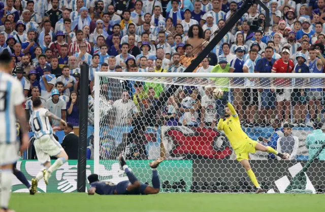 Hugo Lloris of France makes a save against Lionel Messi of Argentina during the FIFA World Cup Qatar 2022 Final match between Argentina and France at Lusail Stadium