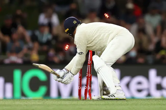 England's Ollie Robinson is bowled during the Hobart Ashes Test