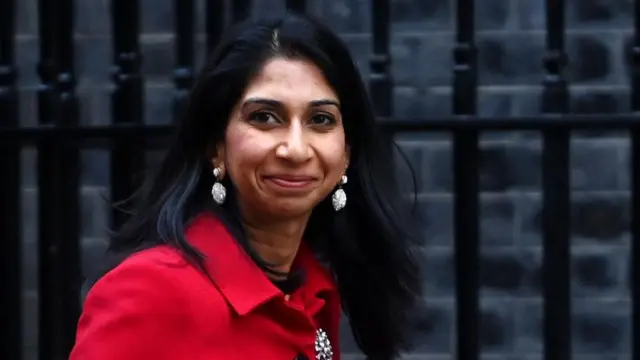 Suella Braverman walks along Downing Street