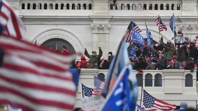 Supporters of President Donald Trump take over balconies at the US Capitol on 6 January 2021