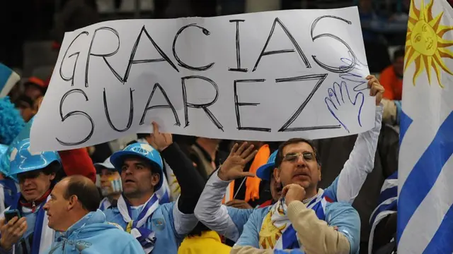 Uruguay fans hold up a sign thanking Luis Suarez