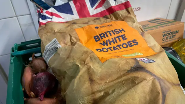 Potatoes seen in a food donation box