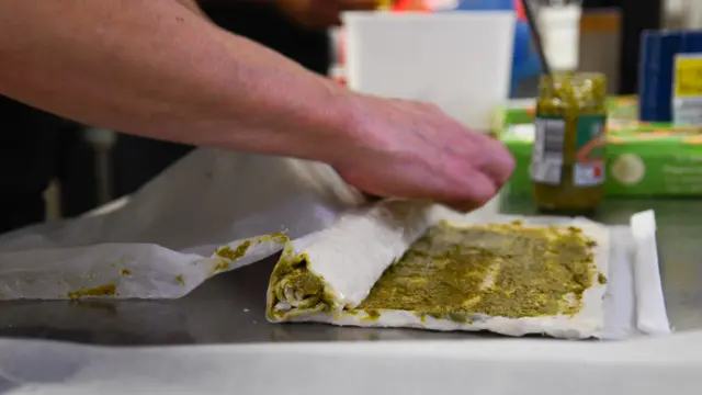 Feast First volunteers preparing lunch for residents at a shelter in north London