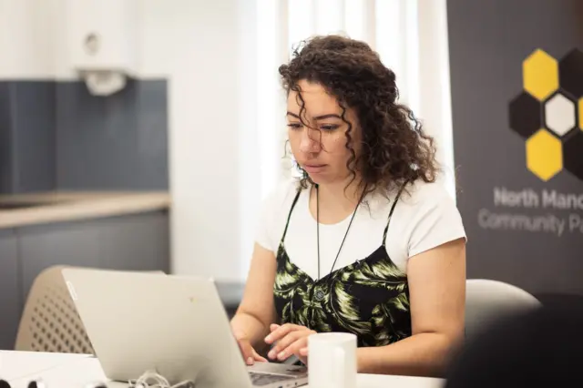 Jade Thomas at her computer