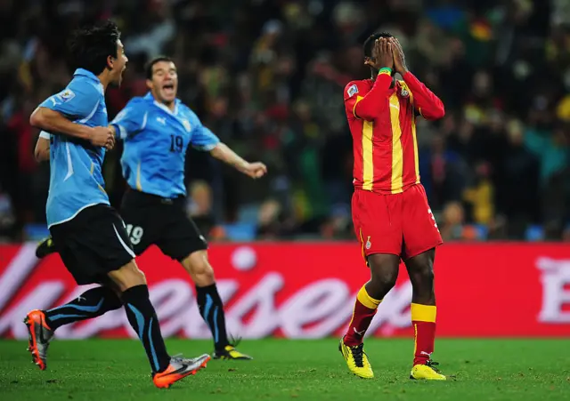 Asamoah Gyan reacts after missing the penalty