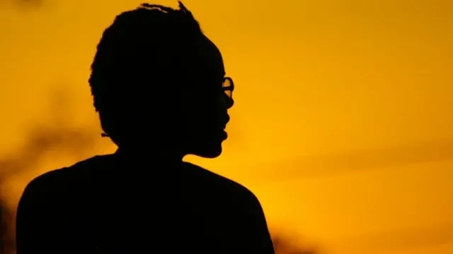 A silhouette of a woman