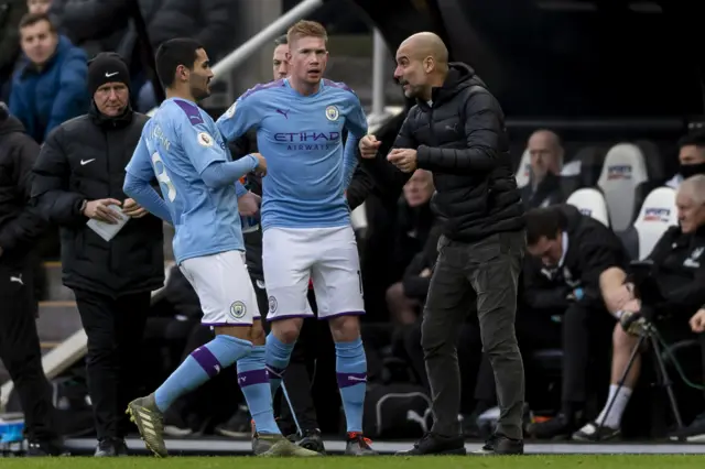 Manchester City manager Pep Guardiola, Kevin de Bruyne and Ilkay Gundogan