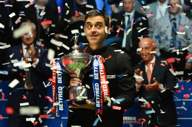 Ronnie O'Sullivan with World Championship trophy