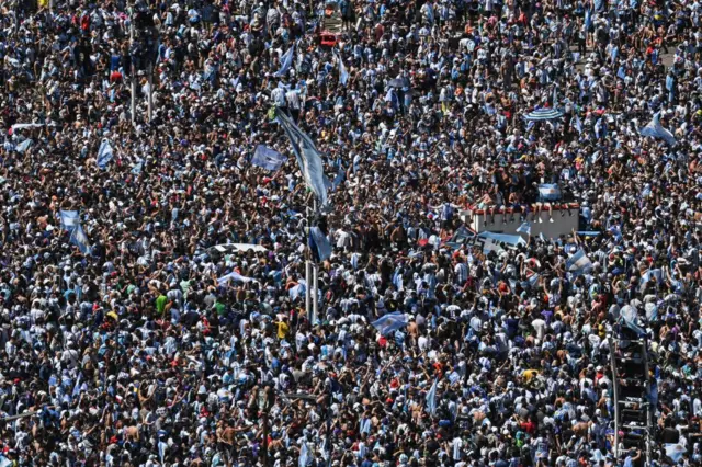 Fans of Argentina wait for the bus with Argentina's players to pass through