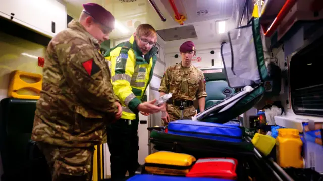 Military personnel in an ambulance