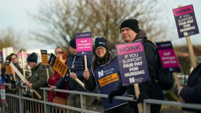 Nursing staff from North Tyneside General Hospital react to support from passing motorists