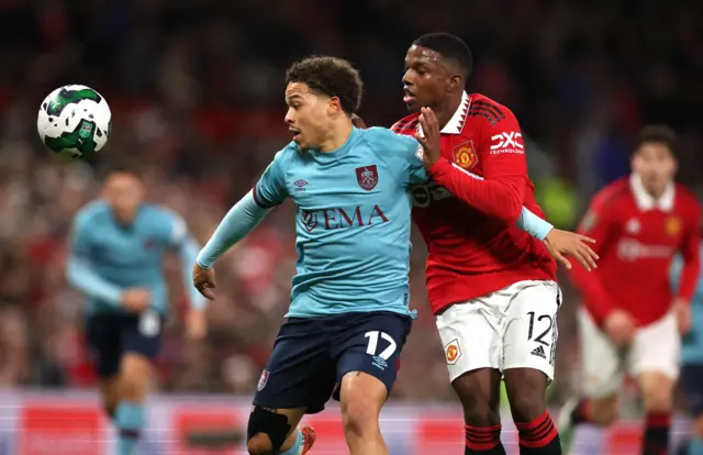 Burnley's Benson Manuel in action with Manchester United's Tyrell Malacia