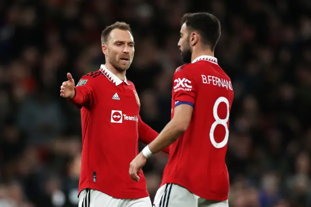 Christian Eriksen celebrates with Bruno Fernandes