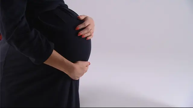 Generic shot of an unidentified woman with a baby bump