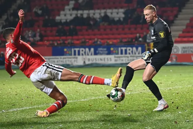 Miles Leaburn challenges Jason Steele