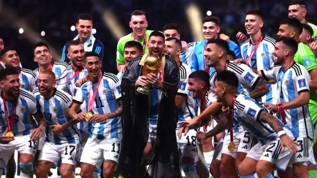 Lionel Messi lifts the World Cup trophy