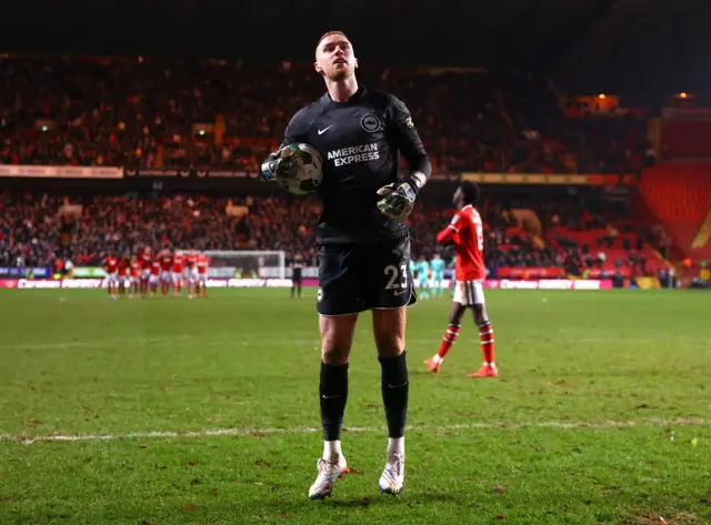 Brighton & Hove Albion's Jason Steele celebrates after he saves a penalty during a penalty shoutout