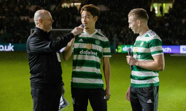 New Celtic signings Yuki Kobayashi (L) and Alistair Johnston during a cinch Premiership match between Celtic and Livingston at Celtic Park