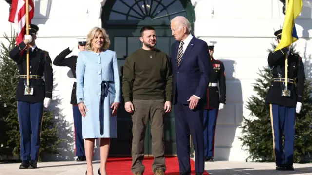 US President Joe Biden (R) and First Lady Jill Biden (L) welcome Ukrainian President Volodymyr Zelensky (C) to the South Lawn of the White House Washington, DC