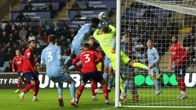 Jonathan Panzo heads against the bar for Coventry