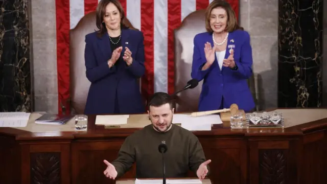 US Vice President Kamala Harris (L) and Speaker of the House Nancy Pelosi (R) applaud during a long ovation before Ukrainian President Volodymyr Zelensky delivers an address to a joint meeting of the United States Congress in the House of Representatives chamber