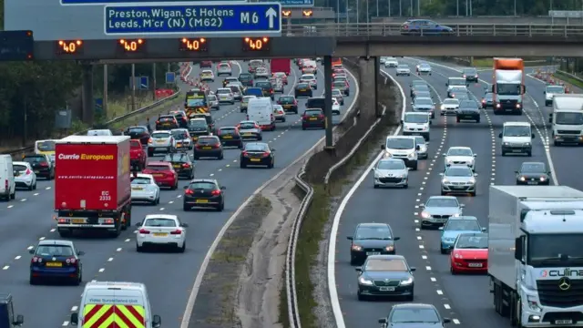 Vehicles travel on a motorway in England