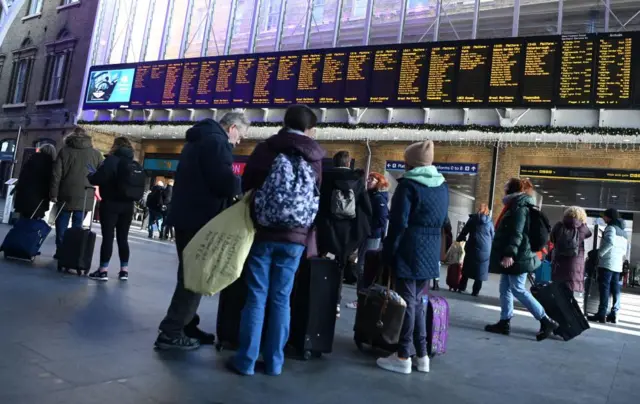 Rail passengers at King's Cross station, London