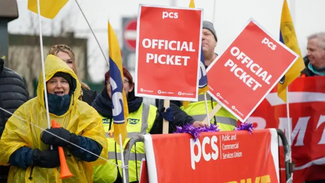 Members of the Public and Commercial Services (PCS) union on the picket line outside Birmingham Airport