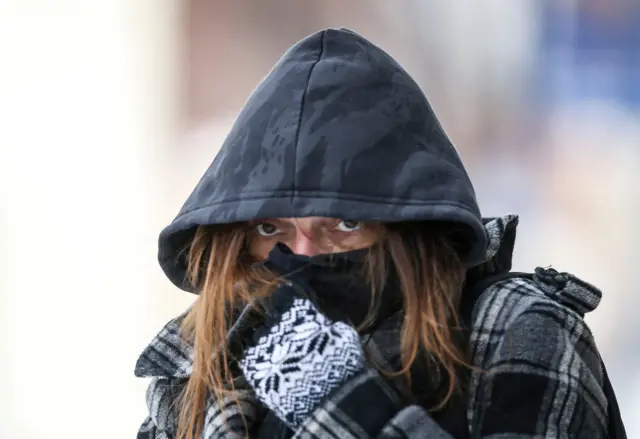 The cold weather has even reached America’s usually warm south. Here, a woman waits for a bus in Louisville, Kentucky.